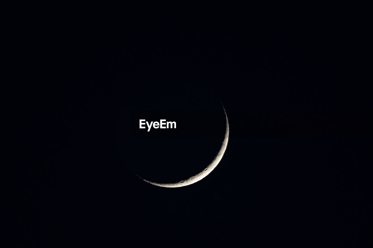 Crescent moon during a clear summer sky