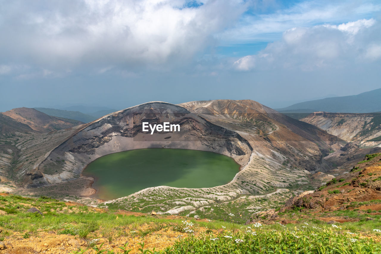 Okama crater lake at mount zao in summer sunny day. active volcano in miyagi prefecture, japan