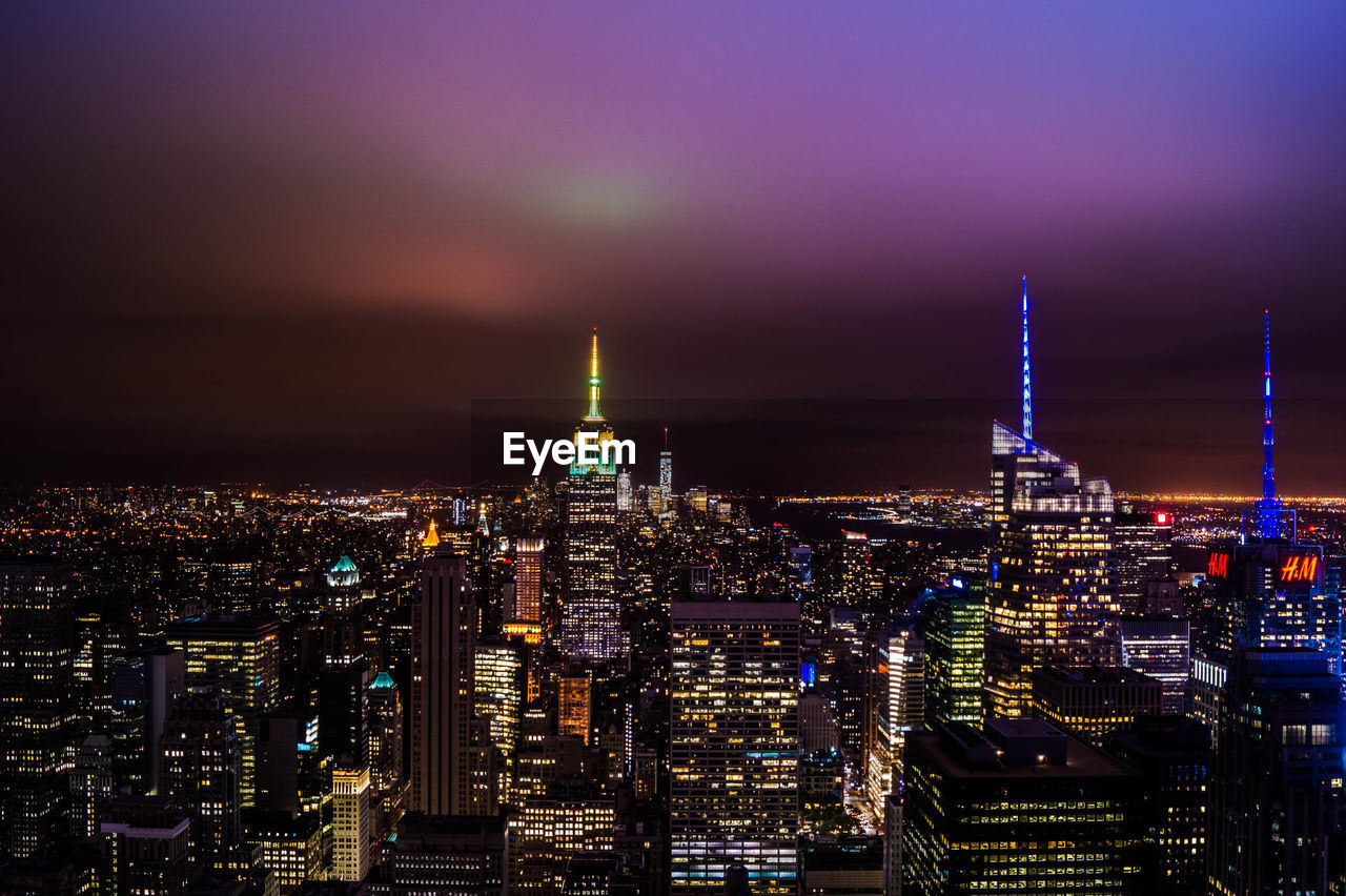 ILLUMINATED CITYSCAPE AT NIGHT