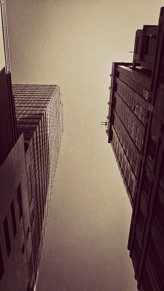 LOW ANGLE VIEW OF MODERN BUILDINGS AGAINST SKY