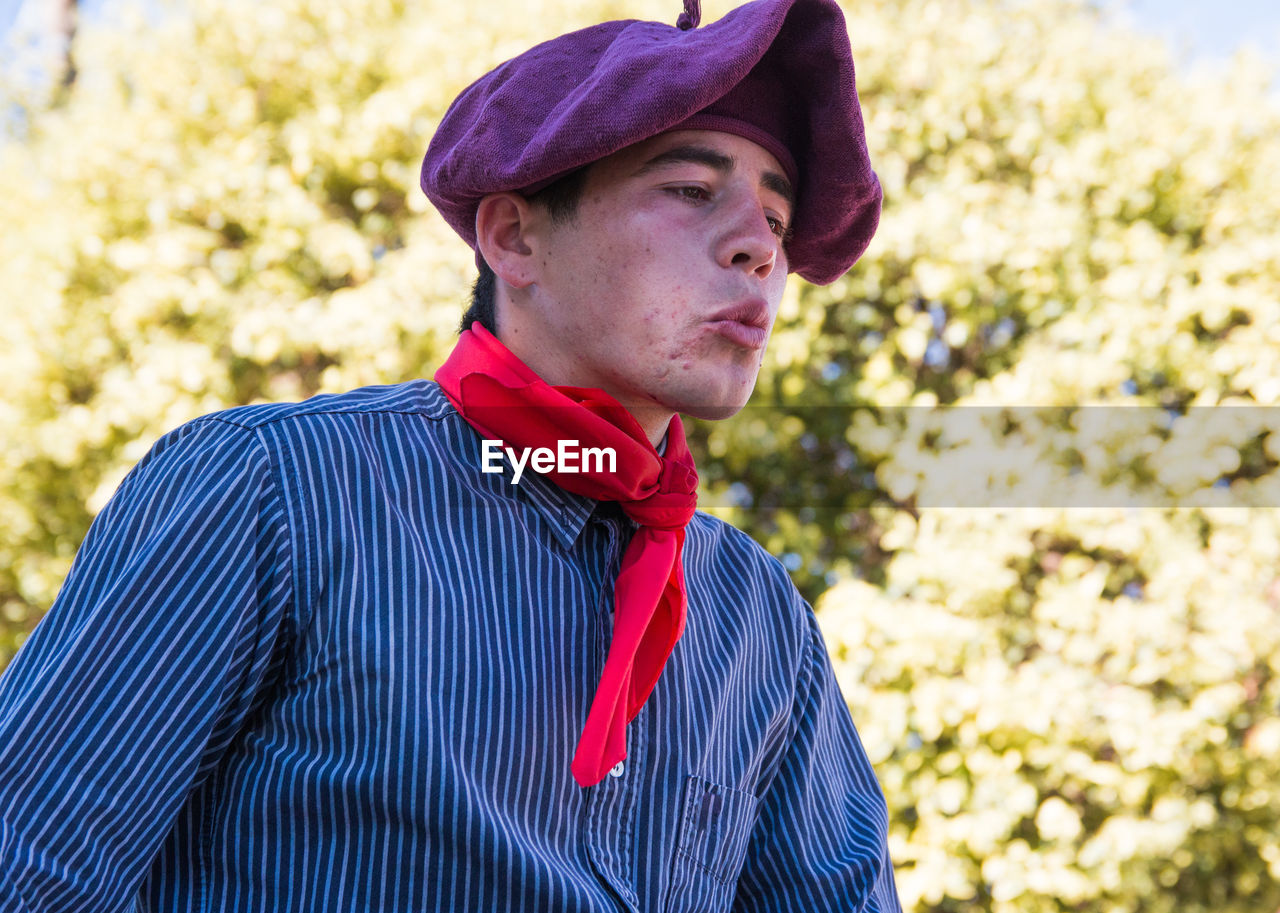 Teenager wearing south american traditional clothing