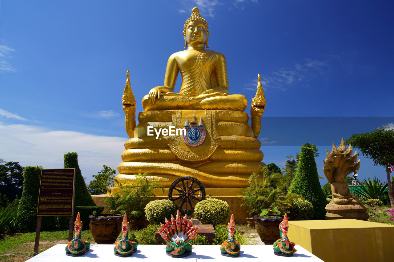 BUDDHA STATUE AGAINST SKY