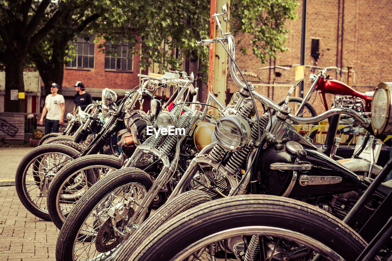 Motorcycles parked on sidewalk