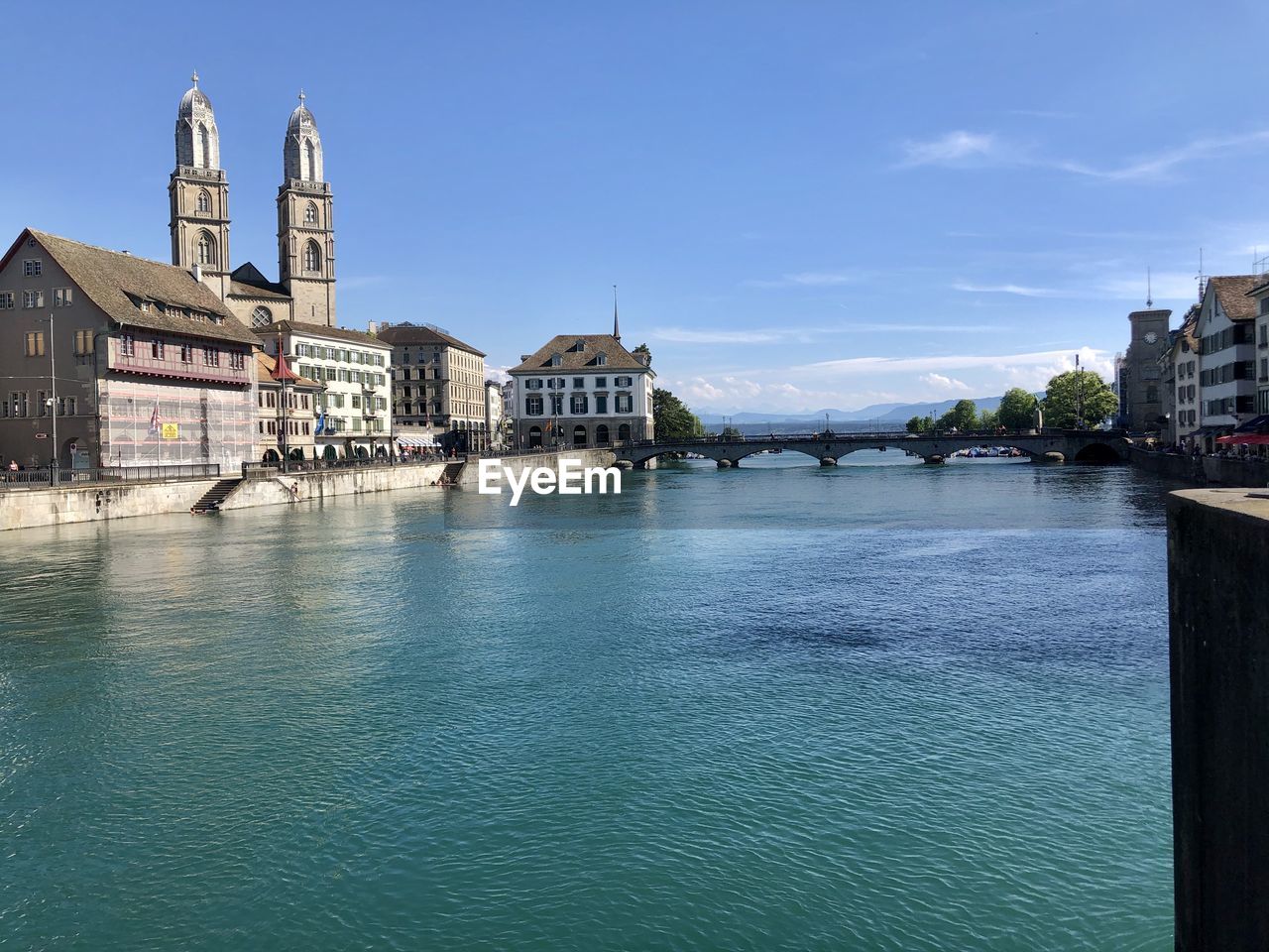 VIEW OF BUILDINGS BY RIVER