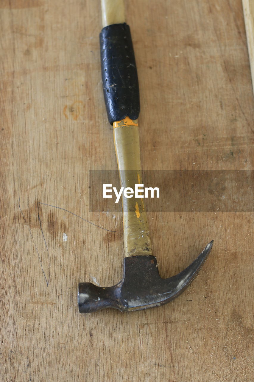 High angle view of hammer on table