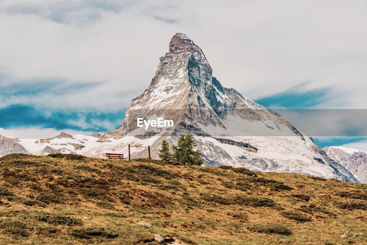 Scenic view of snowcapped mountains against sky