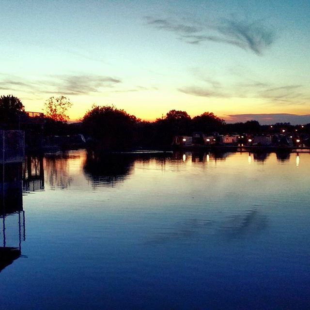 SCENIC VIEW OF RIVER AT SUNSET