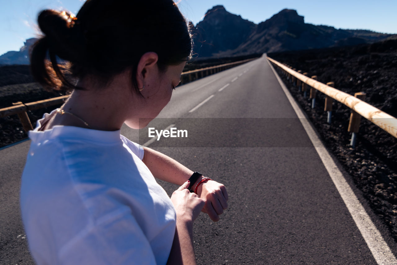 Portrait of man standing on road