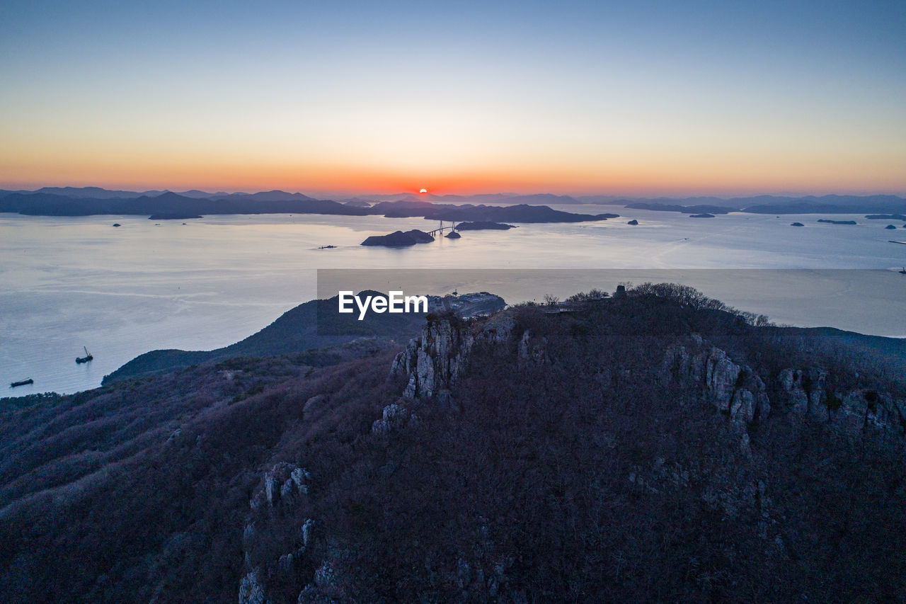 Scenic view of mountain against sky during sunset