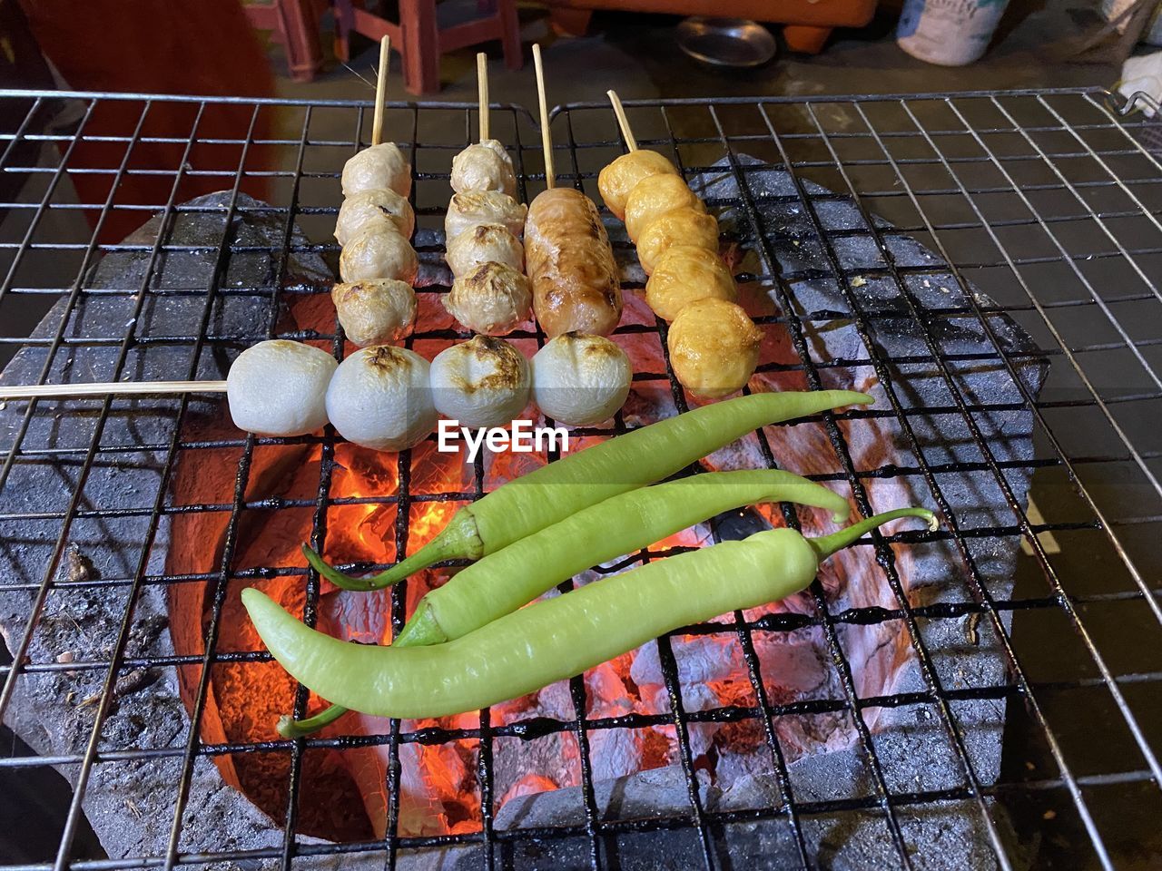 food, food and drink, dish, barbecue grill, barbecue, freshness, grilled, cuisine, grilling, healthy eating, meat, wellbeing, no people, grid, high angle view, sausage, fast food, vegetable, metal grate, heat, grate, day, cooking, preparing food, outdoors, metal, meal, large group of objects