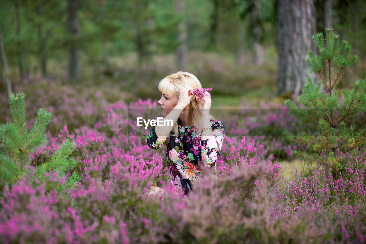 Beautiful woman looking away at lavender field