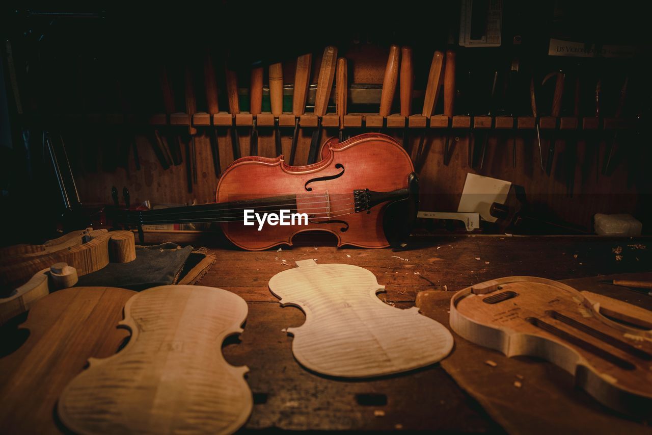 Violin on chair at workshop