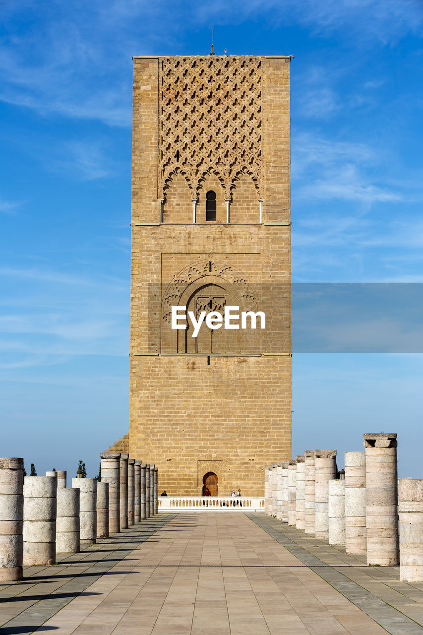 Hassan tower against blue sky