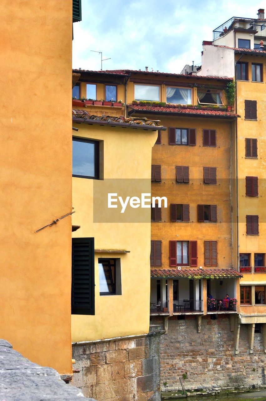 Buildings in city against sky