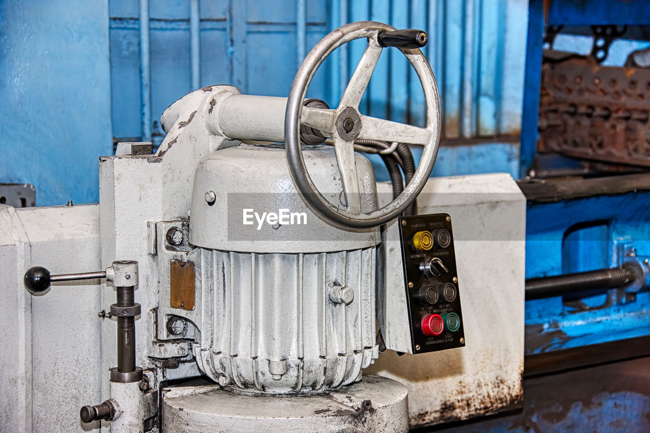 CLOSE-UP OF OLD MACHINERY