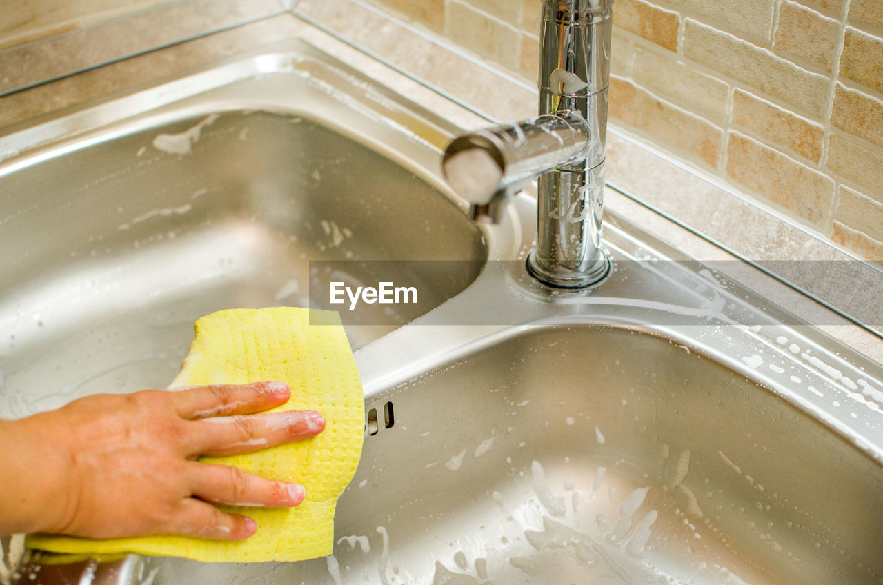 Hand chores sink cleaning with sponge