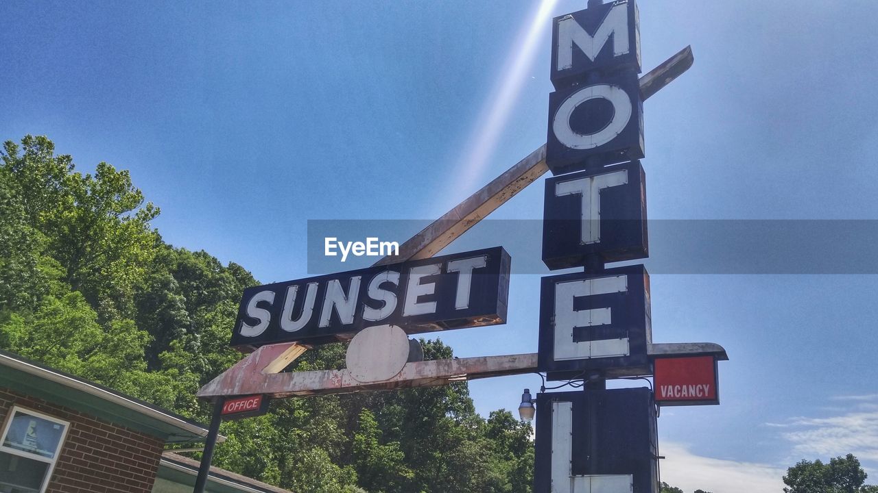 LOW ANGLE VIEW OF ROAD SIGNS