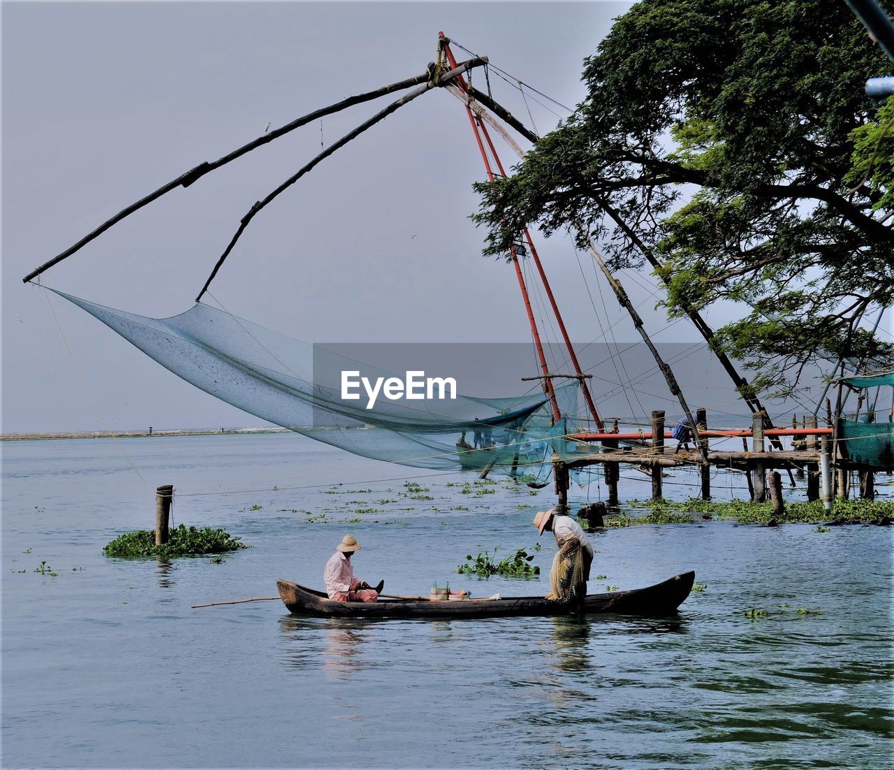 PEOPLE ON BOAT IN RIVER