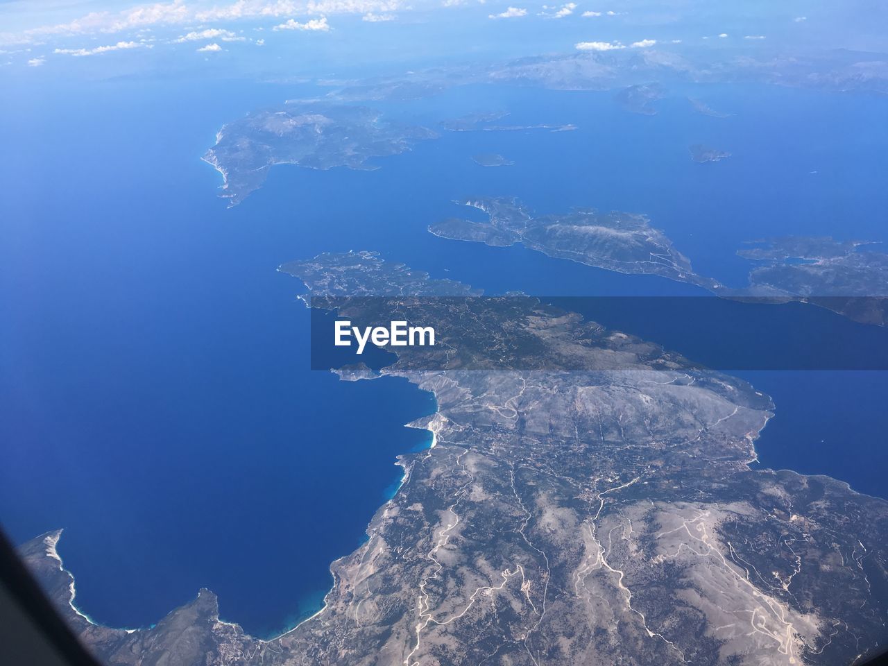 AERIAL VIEW OF BLUE SEA AGAINST SKY