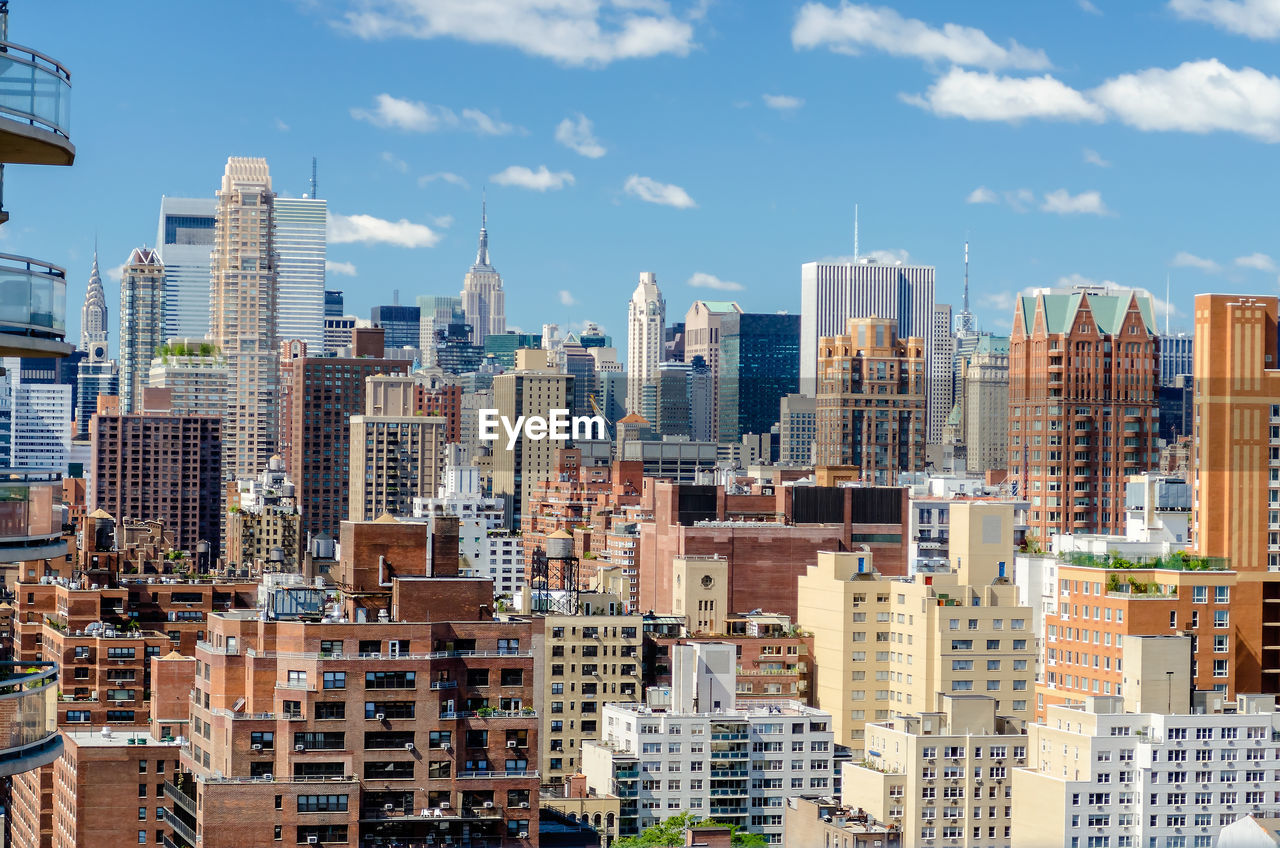 View of buildings in city against sky