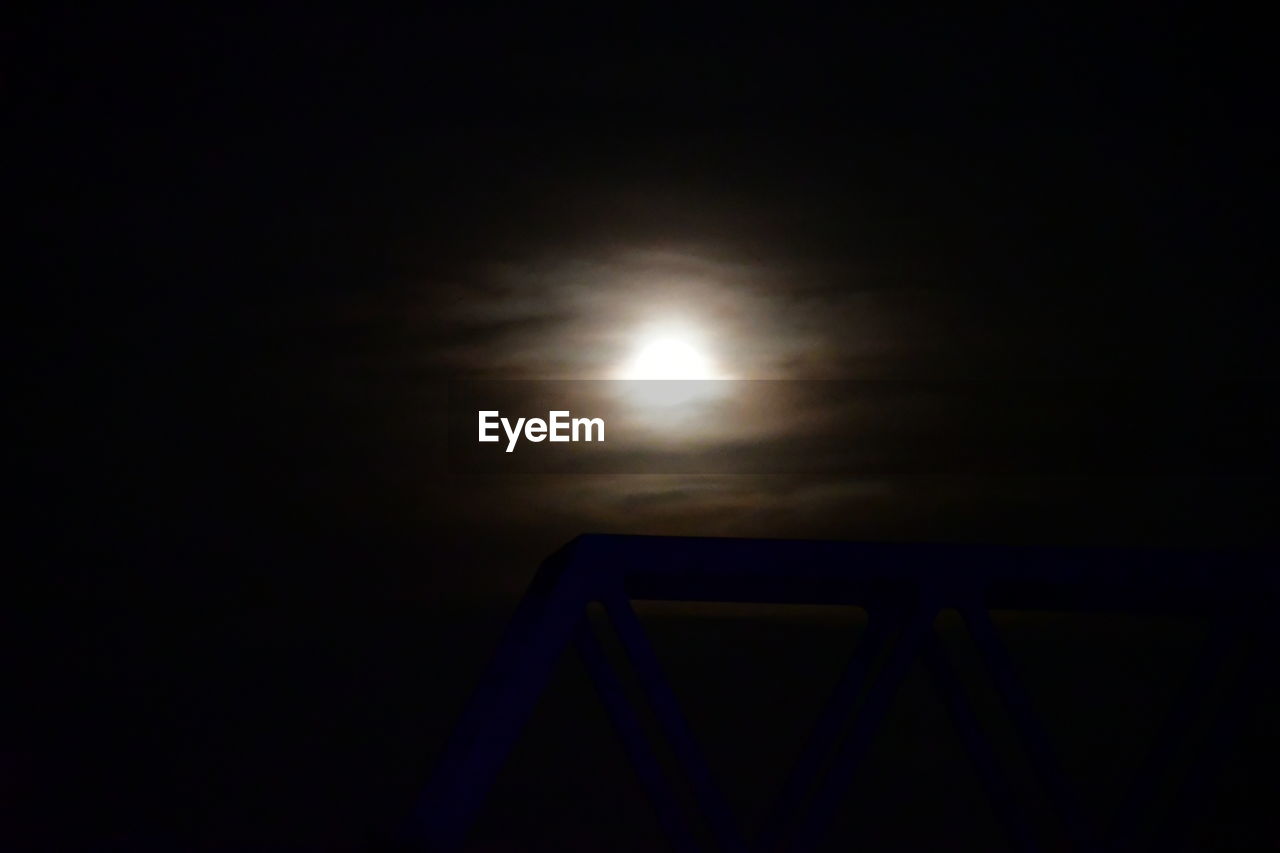 LOW ANGLE VIEW OF MOON IN SKY AT NIGHT