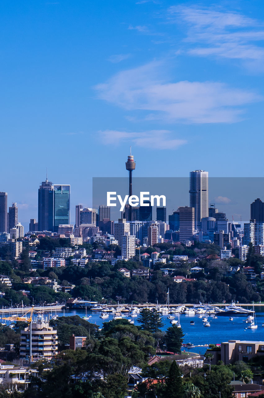 View of cityscape against blue sky