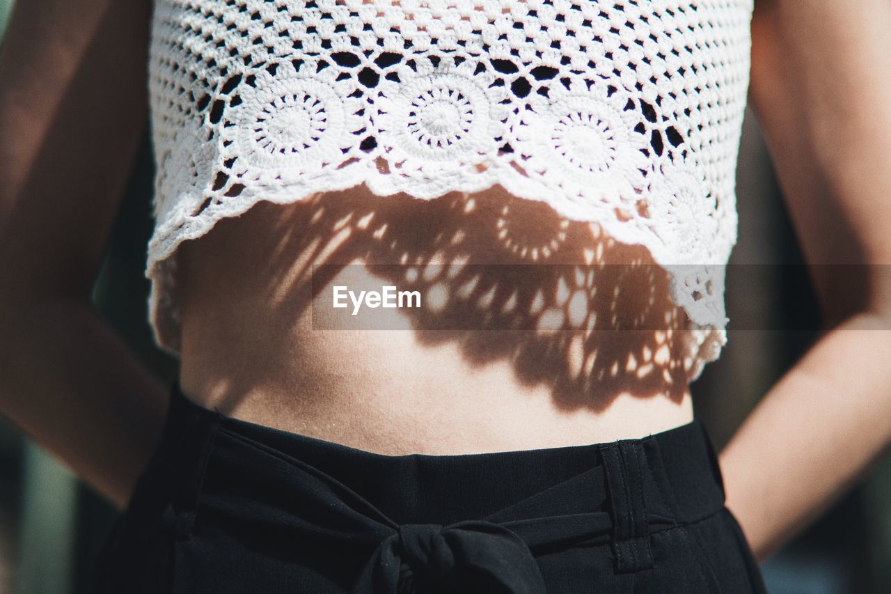 Midsection of woman wearing crop top
