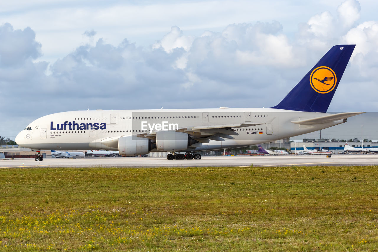 VIEW OF AIRPLANE ON AIRPORT RUNWAY