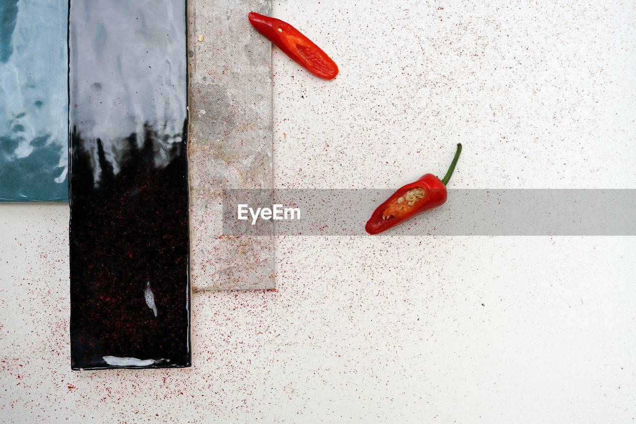 High angle view of red chili peppers on table