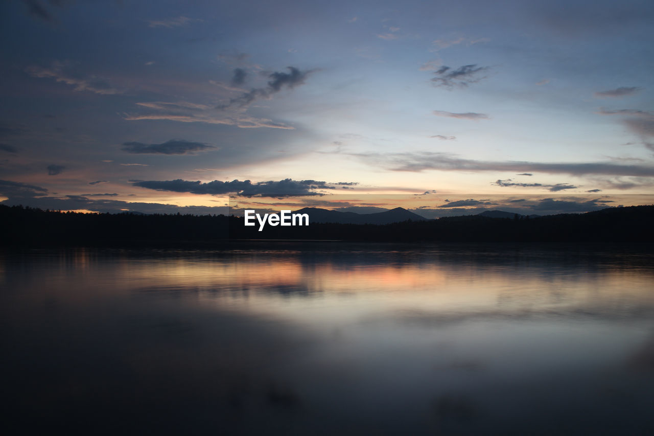 Silhouette of lake at sunset