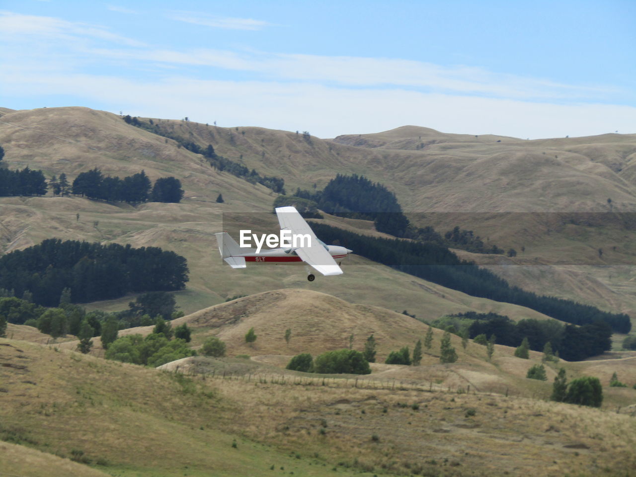 Airplane flying over landscape