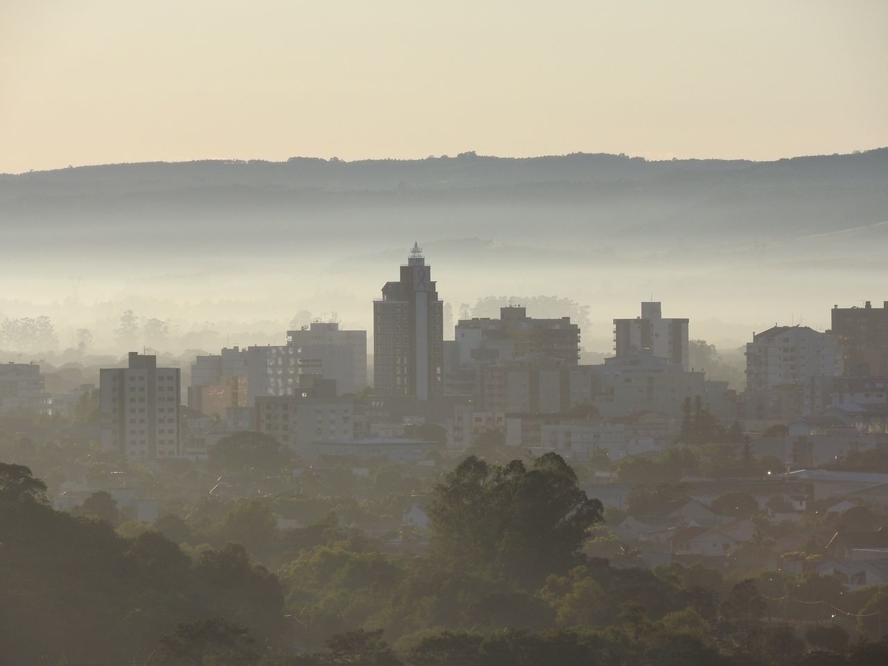 Panoramic shot of buildings against clear sky