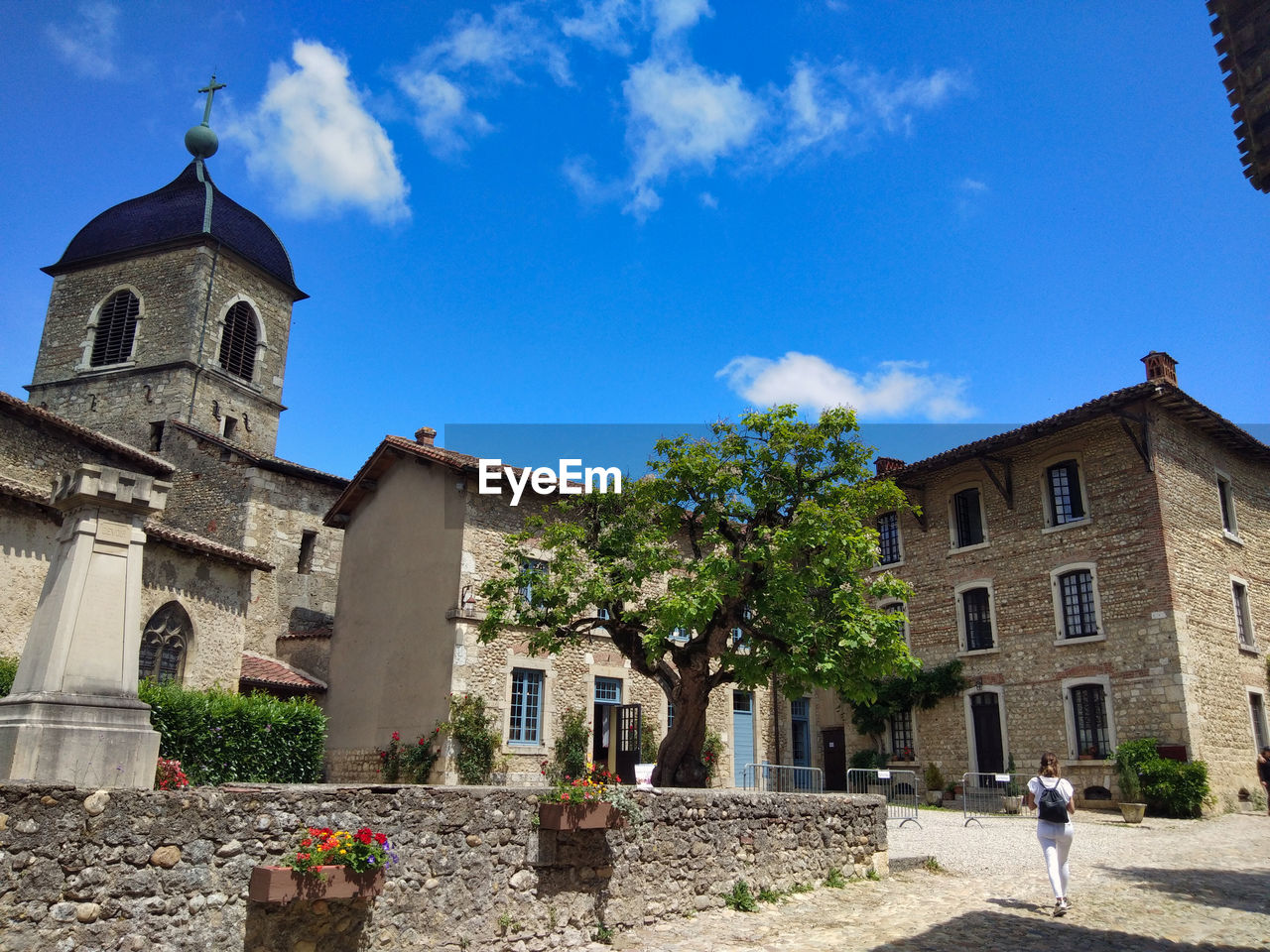 Village square and old church of the medieval city of pérouges, france