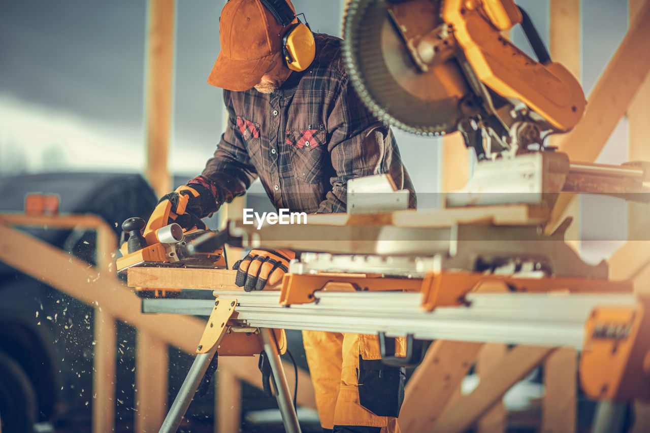 Man working on wood at workshop