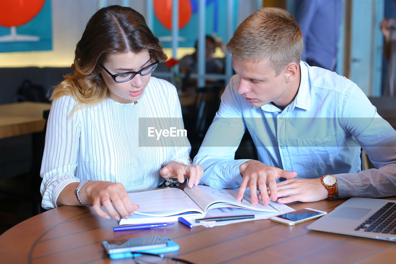 Business colleagues working at office