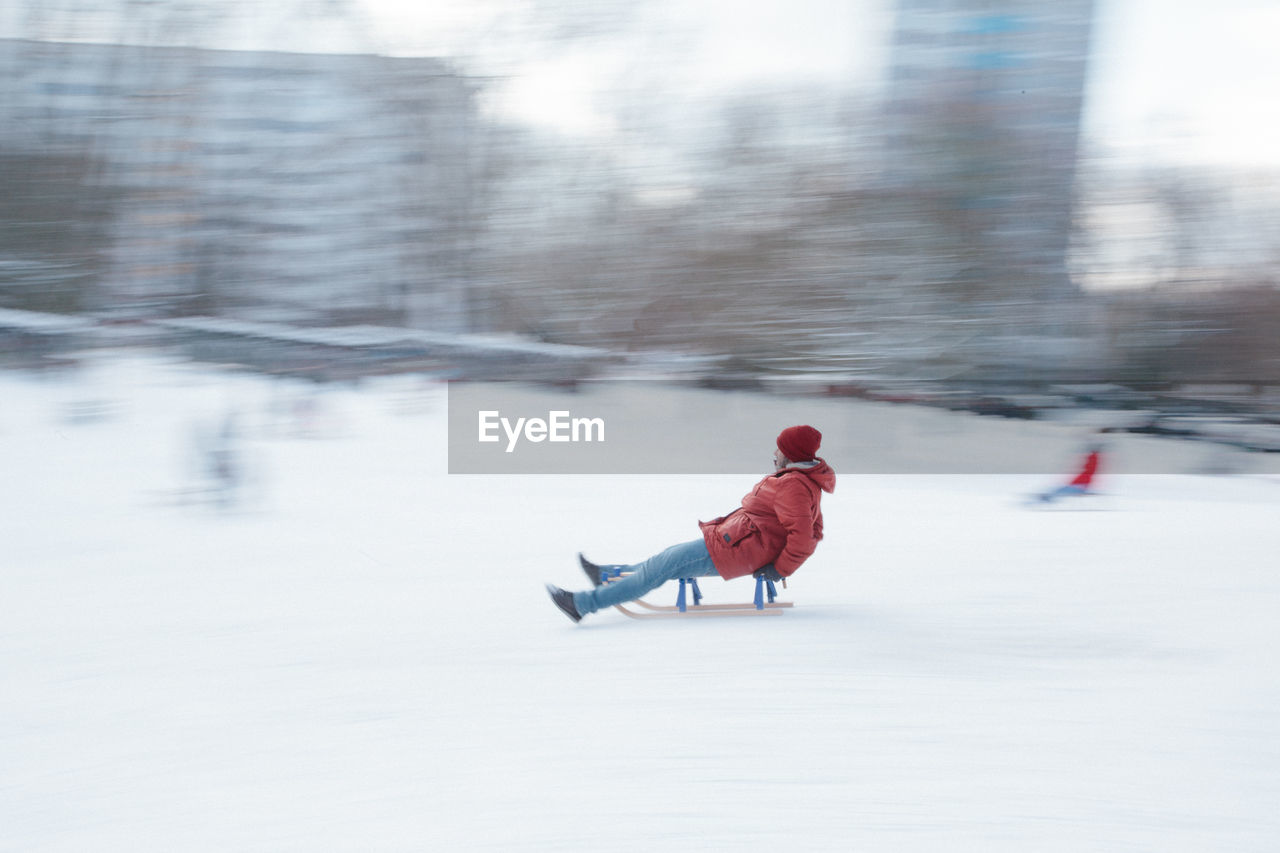 Boy on snow covered field