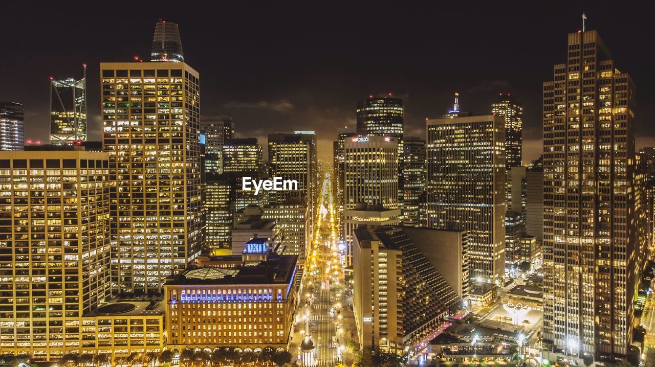 Illuminated buildings in city at night