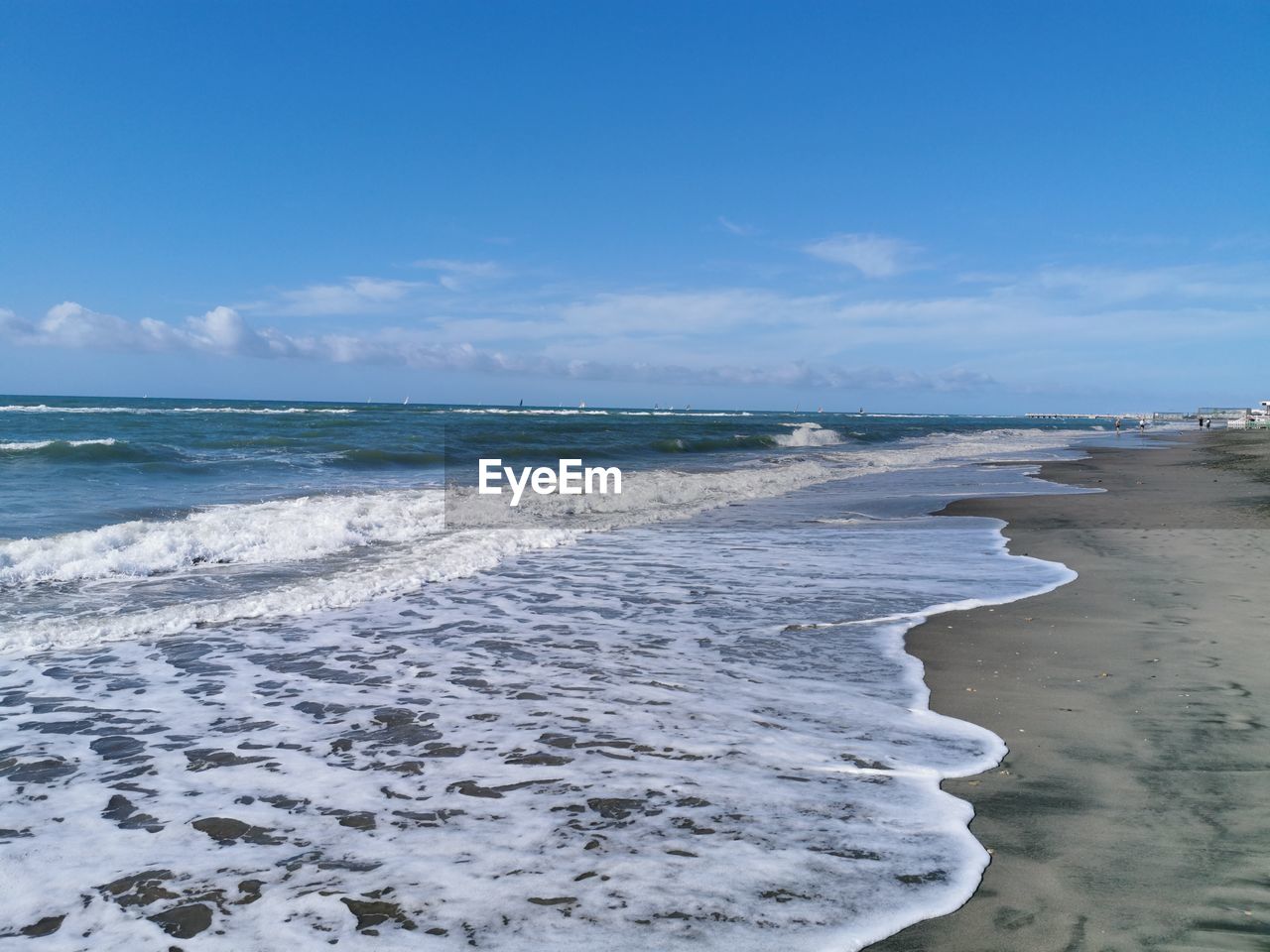 PANORAMIC VIEW OF BEACH AGAINST SKY