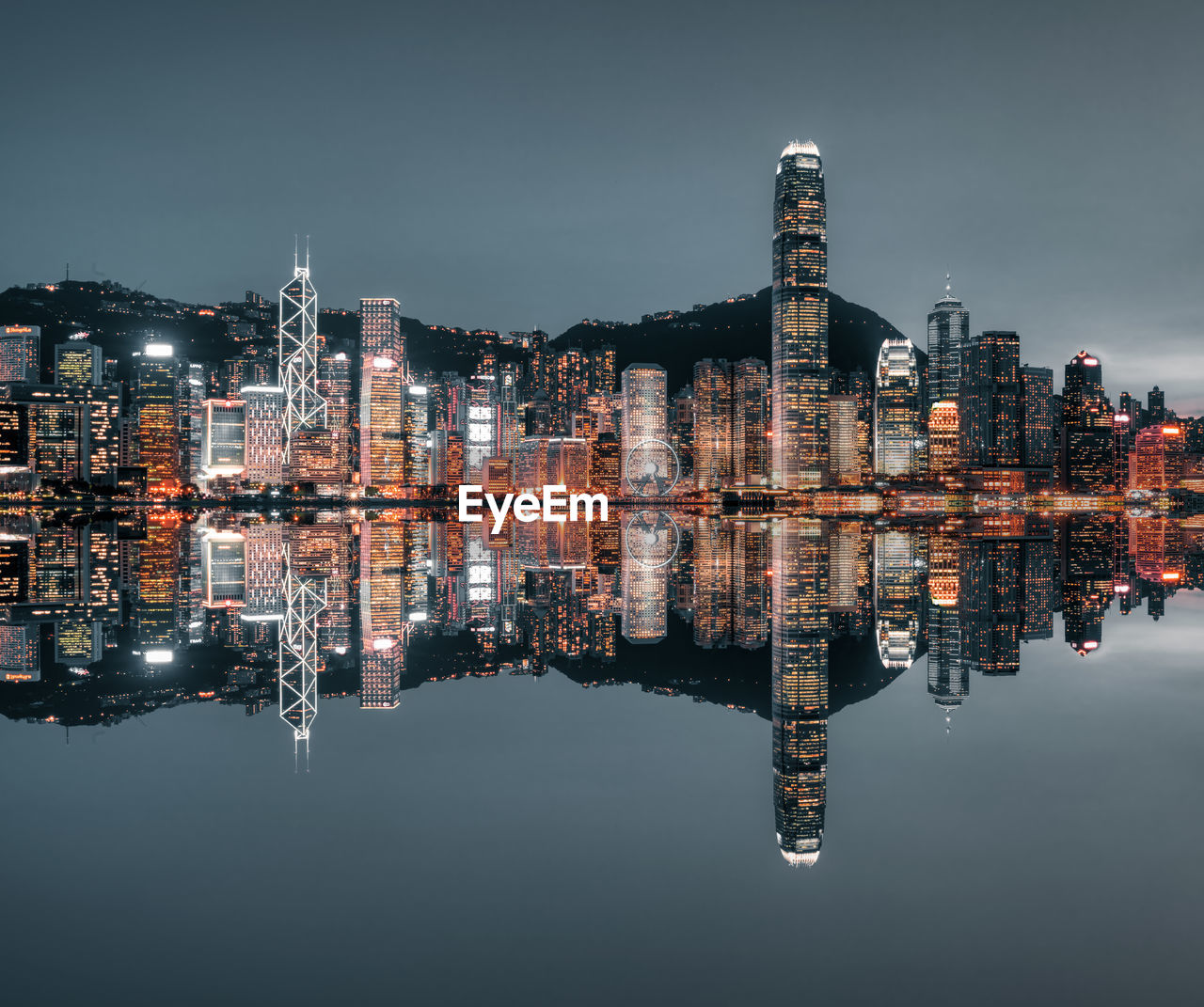 Reflection of illuminated buildings in lake at night