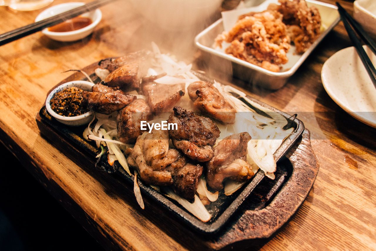 High angle view of chicken served in tray at table