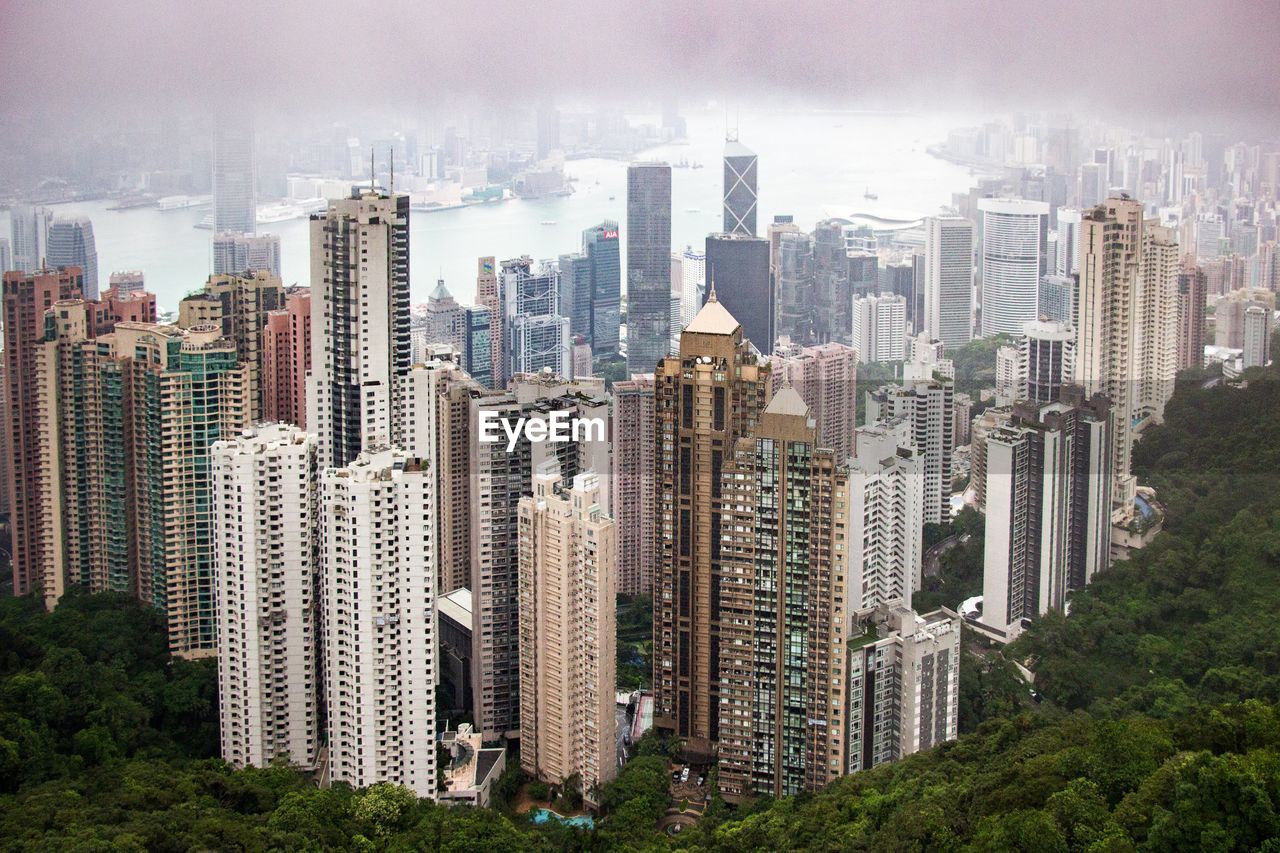 High angle view of buildings in city against sky