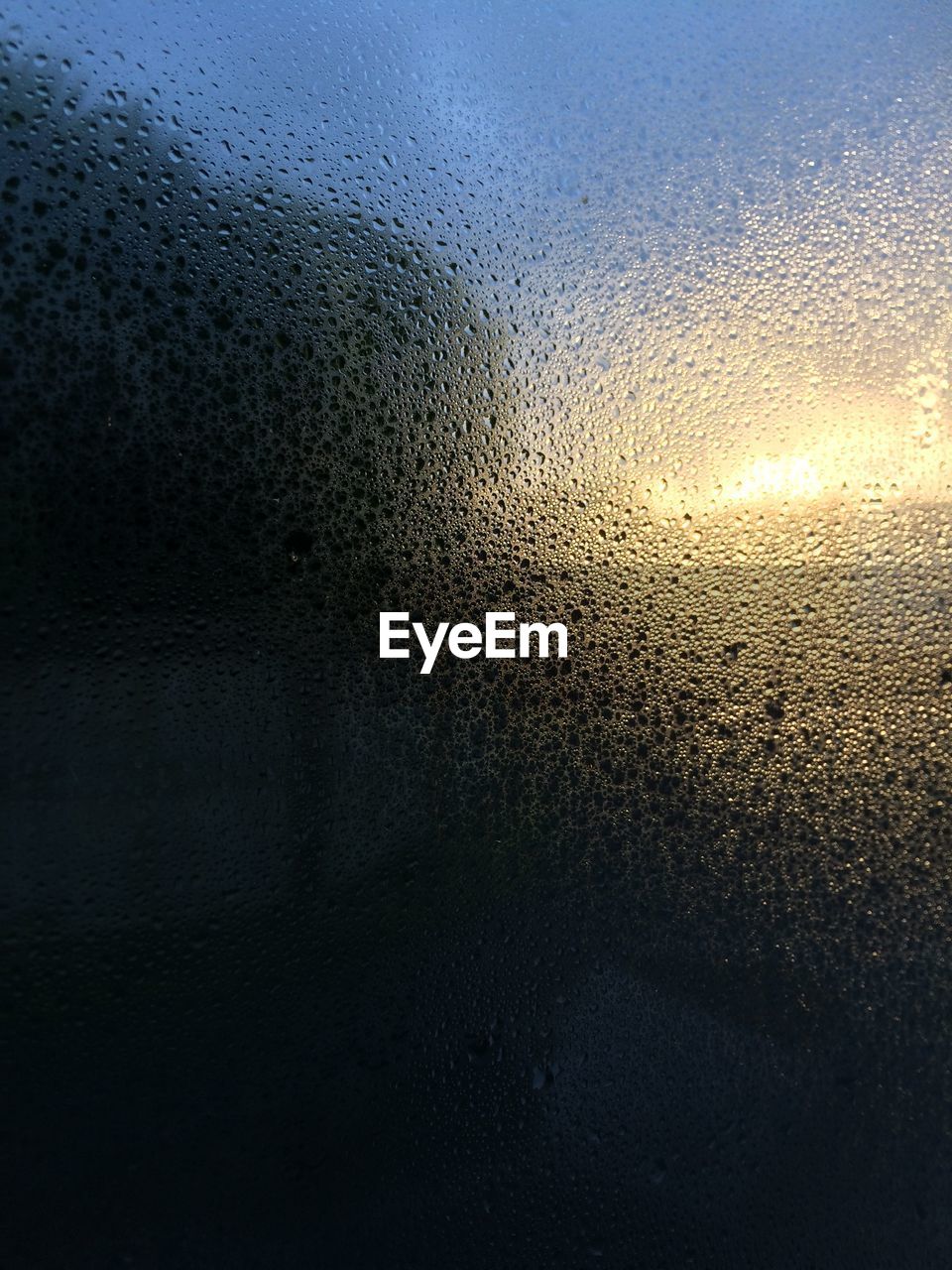 FULL FRAME SHOT OF WET WINDOW IN SKY