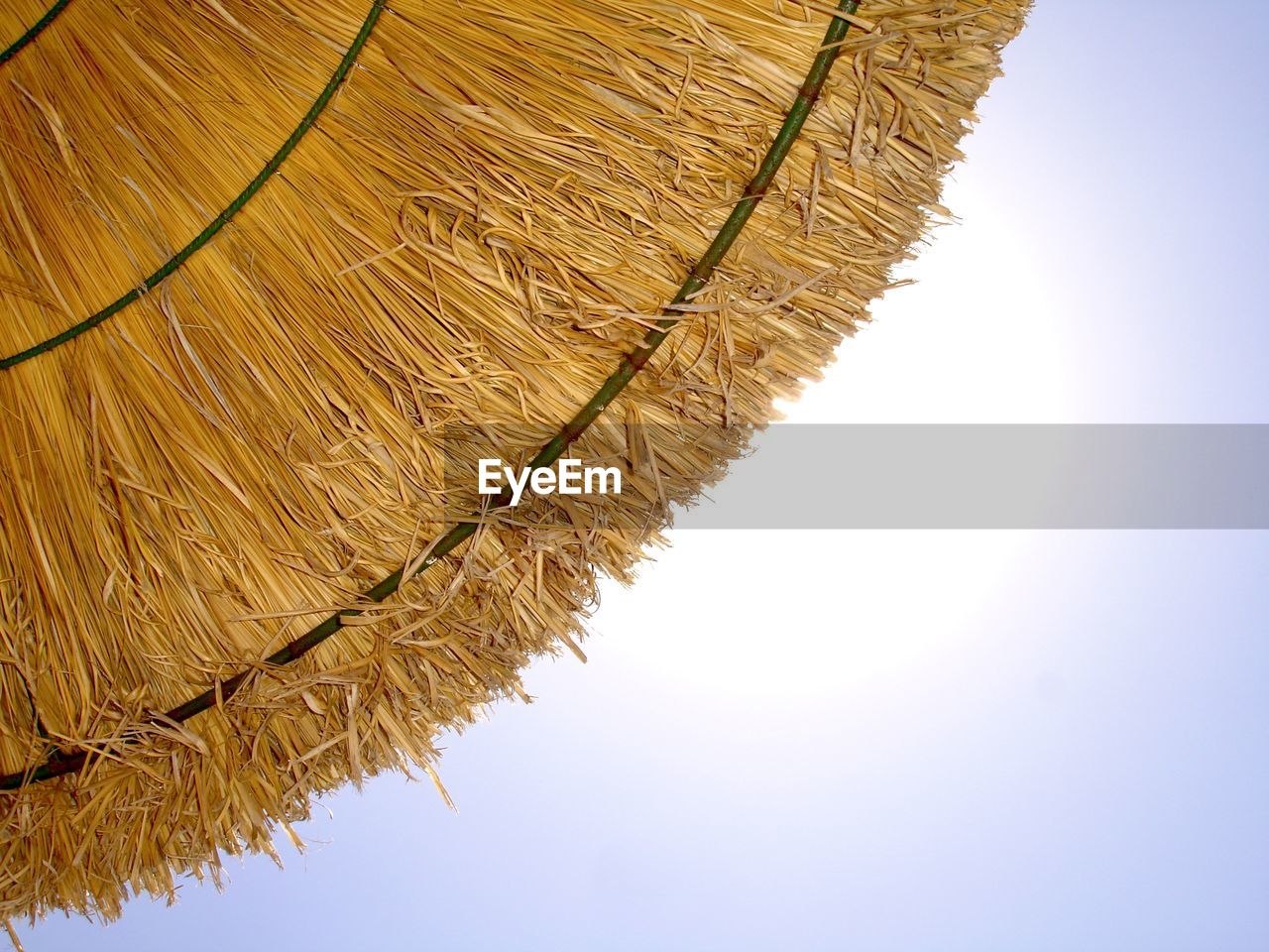 close-up of thatched roof against sky