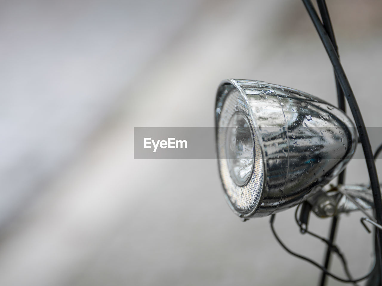 A bicycle headlight with raindrops