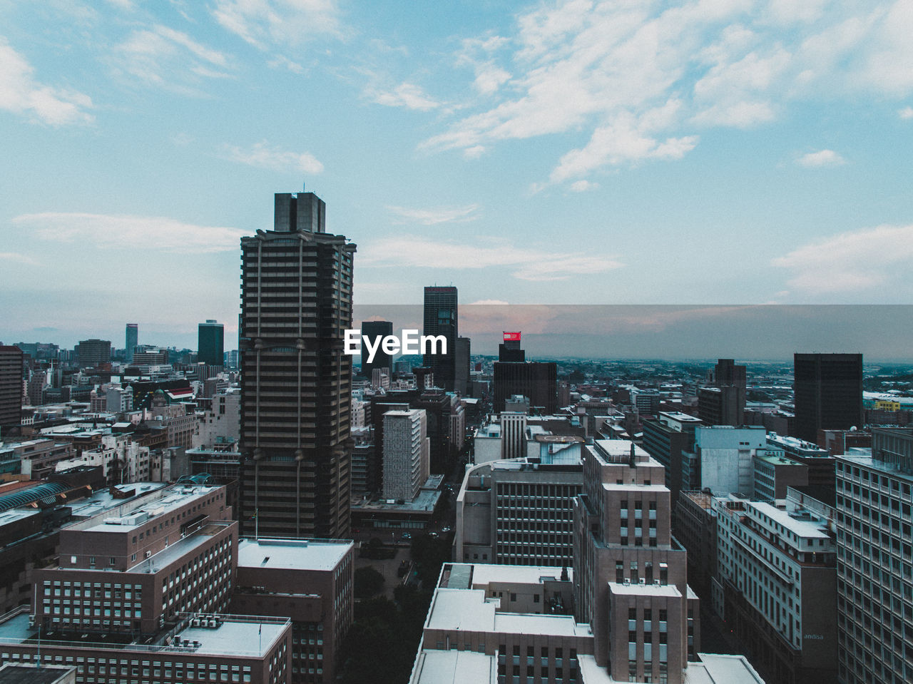 Modern buildings in city against sky