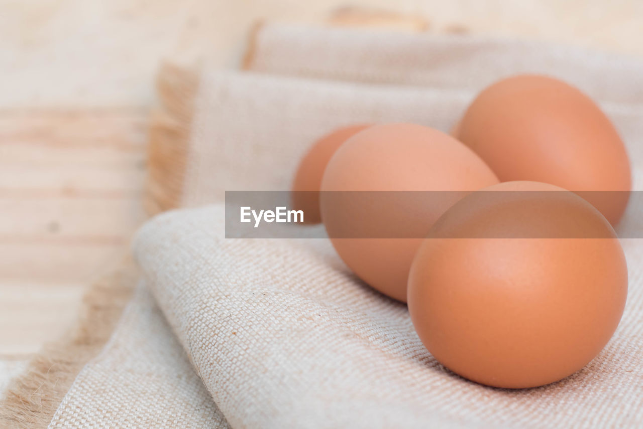 HIGH ANGLE VIEW OF EGGS IN CONTAINER