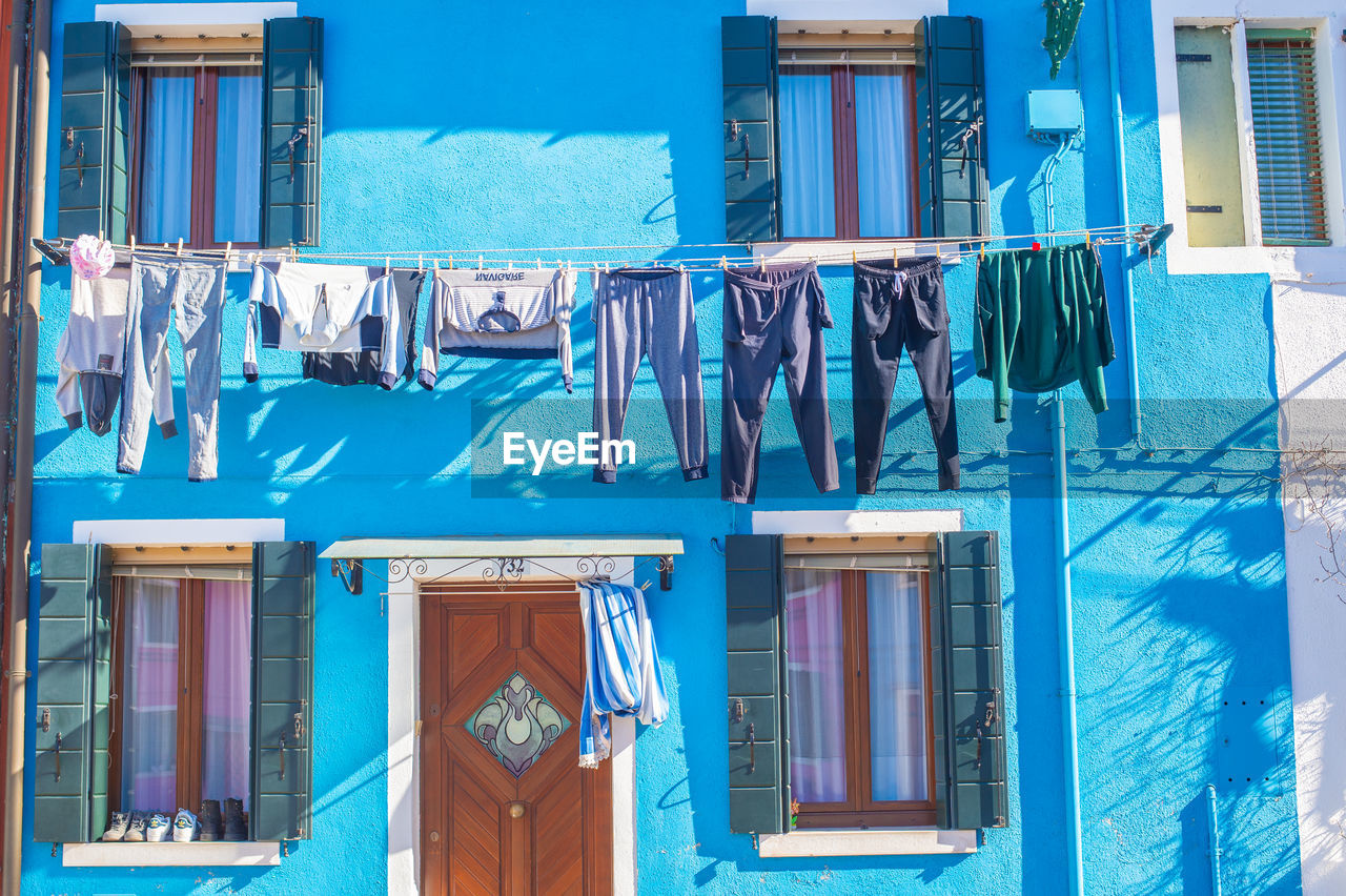 CLOTHES DRYING OUTSIDE BUILDING