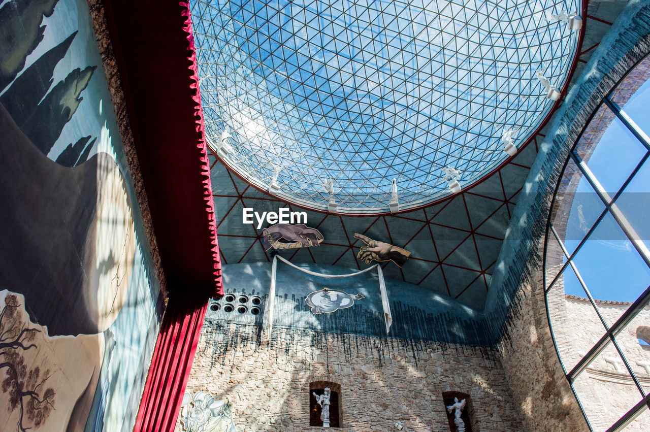 LOW ANGLE VIEW OF CLOTHES HANGING ON BUILDING