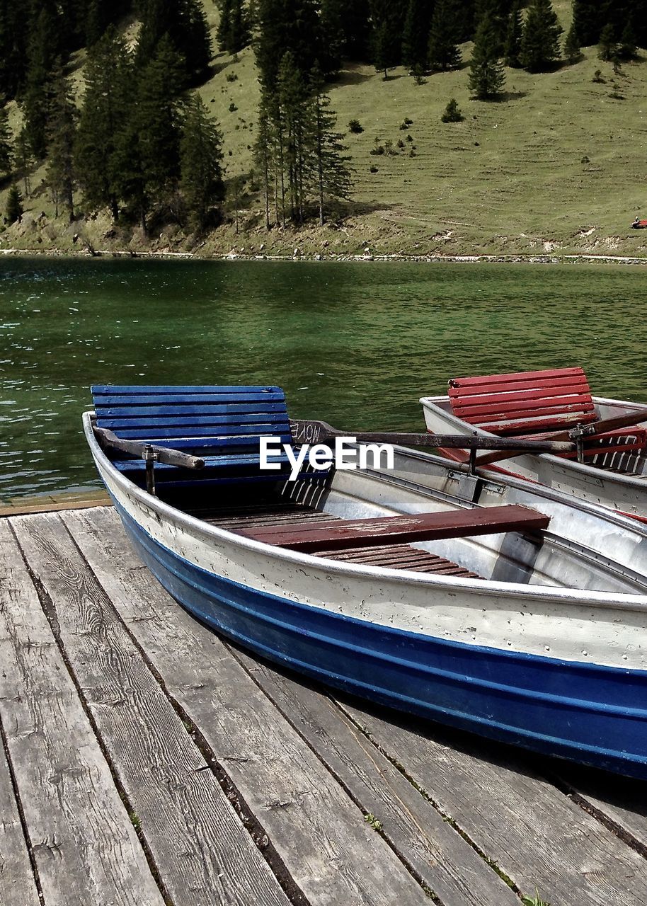 Boat moored on lake