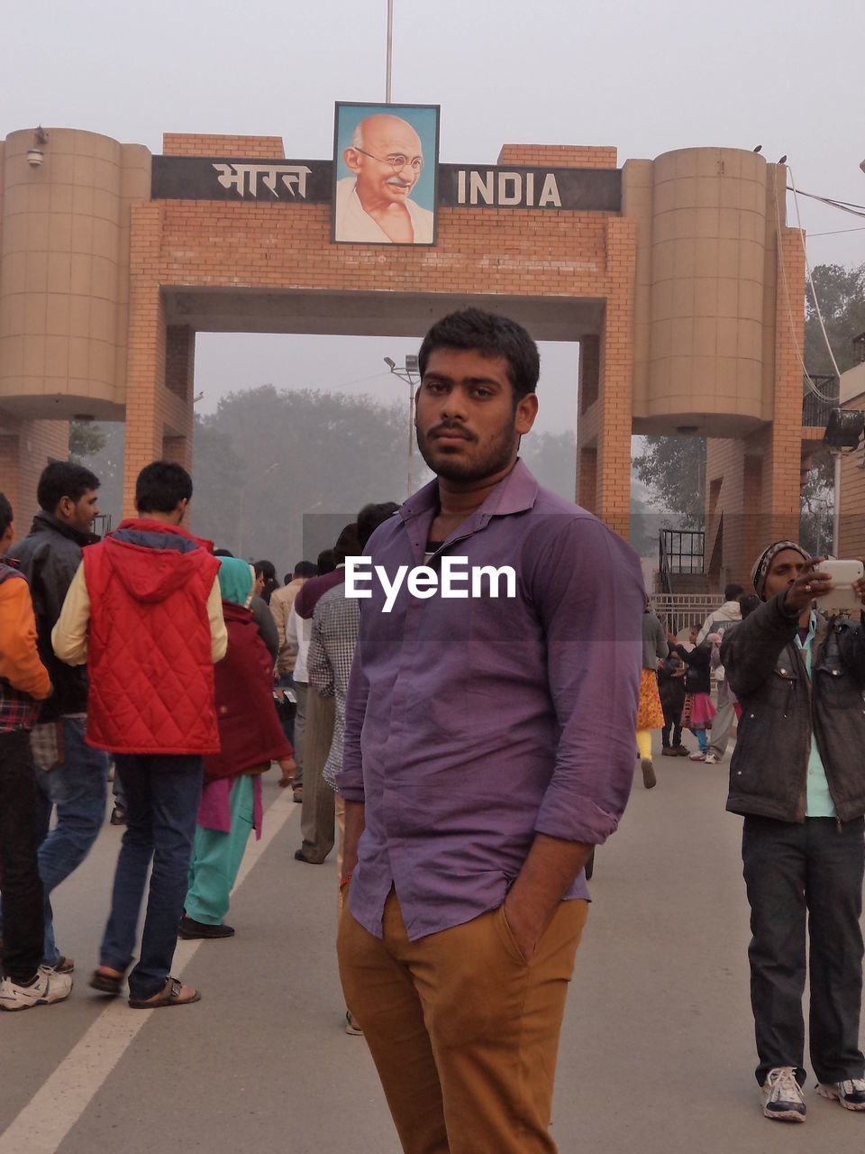 MAN STANDING IN CITY